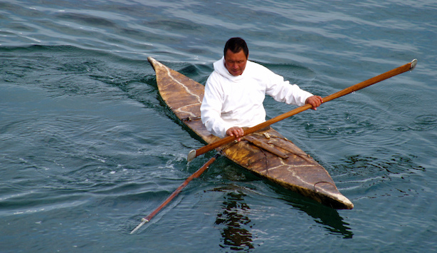 Inuit kayaking on water